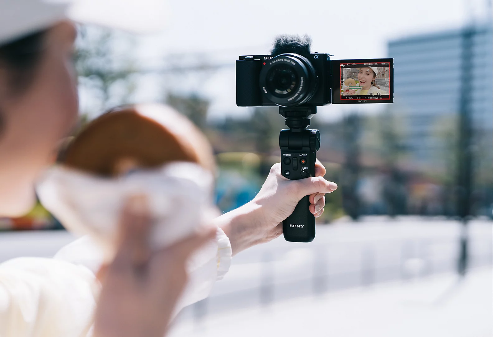 YouTube creator filming with Sony ZV-E10 camera